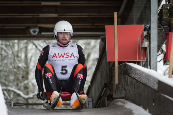 Image of LCpl Steve Webb RTR taking part in the Luge event. 

Exercise RACING ICE 2 is the Army Novice, Junior and Senior Ice Championships which was held in Winterberg, Germany from 24 Jan to 3 Feb 18.

Luge is a long established Olympic sport and the Army has two past Olympic representatives. Prospects for Army athletes to compete at the Vancouver Olympic Games in 2010 were high but the selection standard was even higher! We hope that 2018 will represent our return to form! Natur luge, where the sled is steered literally through breaks in the forest, is a fast growing variant.

Racing Ice involved Bobsleigh, Skeleton and Luge. The exercise comprised of a training week followed by a race day.  Those successful at Racing Ice 2 will stand a good chance of being selected to represent the Army at the Inter Service Championships.

The Army Winter Sports Association (AWSA) was formed (as the Army Ski Association) in 1947, at the behest of Field Marshal Montgomery. Monty wished to provide a break from routine training and operations in the immediate post-war years, whilst developing military and technical skills on snow and ice.